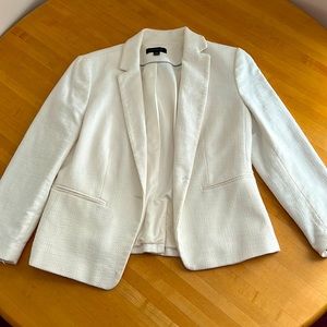 Bought 3 years ago and used it once. Ann Taylor, white with rich texture :)